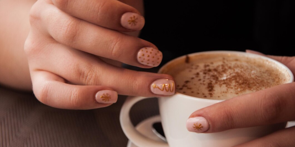 close-up-hands-holding-coffee-cup_1048944-16398937