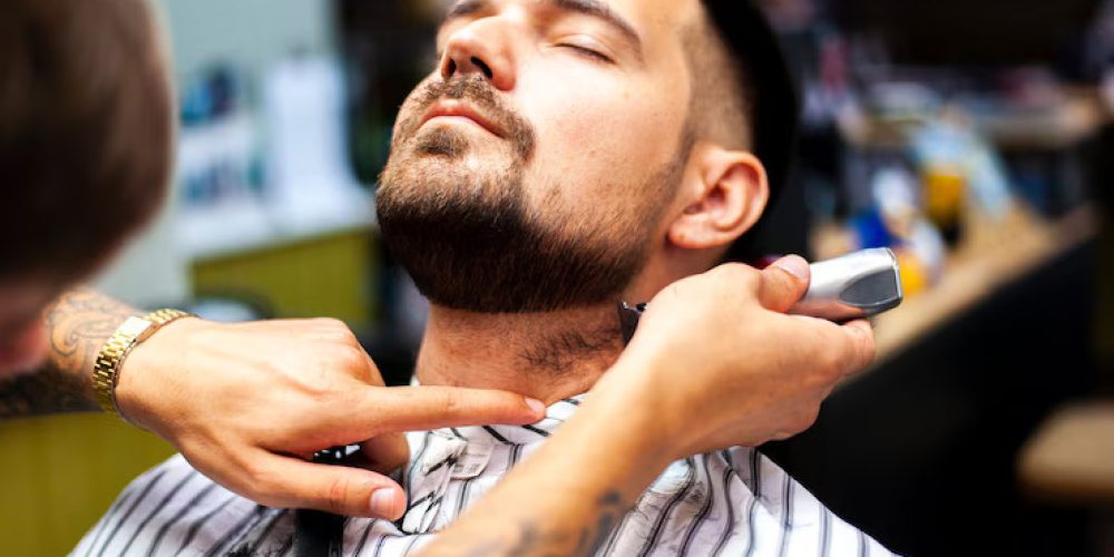front-view-man-getting-beard-trimmed_23-2148256923