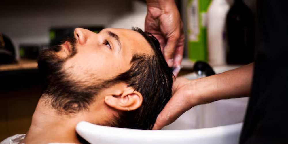 sideways-man-getting-hair-wash_23-2148256873